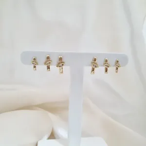 Brinco trio olho grego