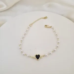 Pulseira perolas e coracao zirconia preta