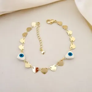 Pulseira chapa coracao e olho grego em formato de coracao