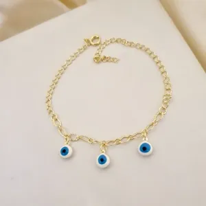 Pulseira elo diamantado e 3 pingentes olho grego