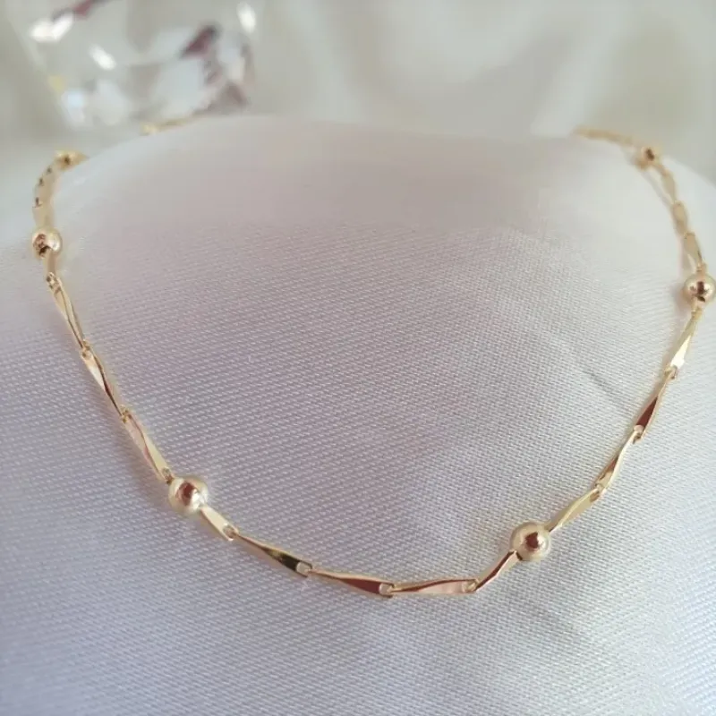 Choker com bolinhas e elos trabalhados