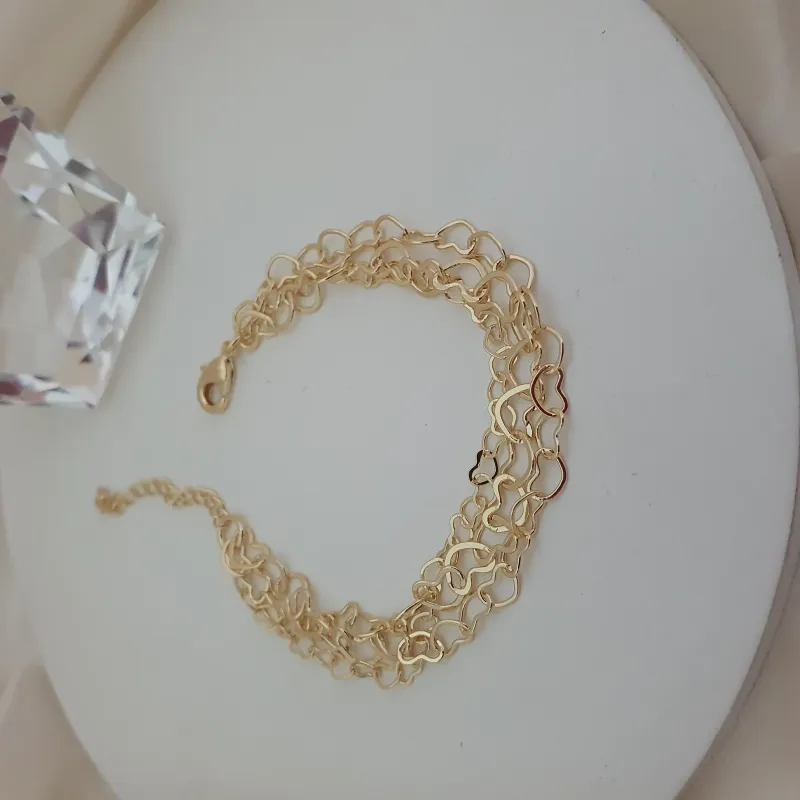 Pulseira tripla com elo de coração