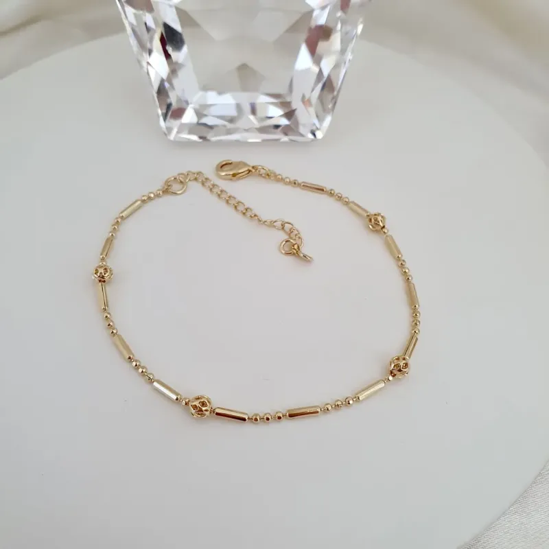 Pulseira esferas, tubos e bolinhas