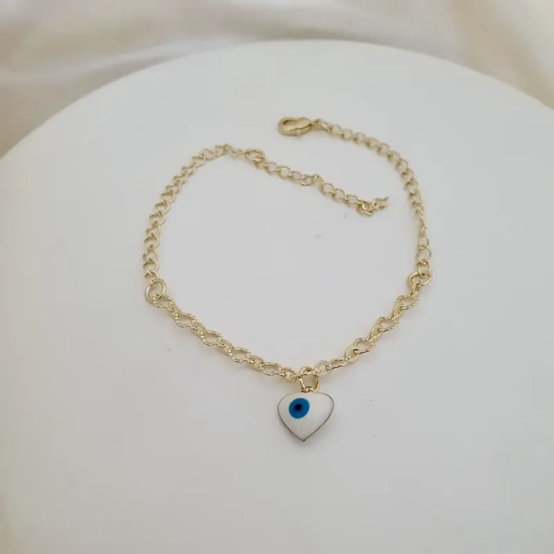 Pulseira elo diamantado e pingente de coração olho grego