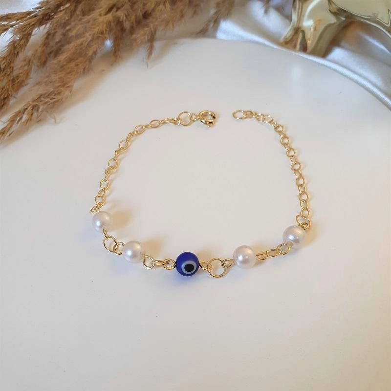 Pulseira olho grego e pérolas