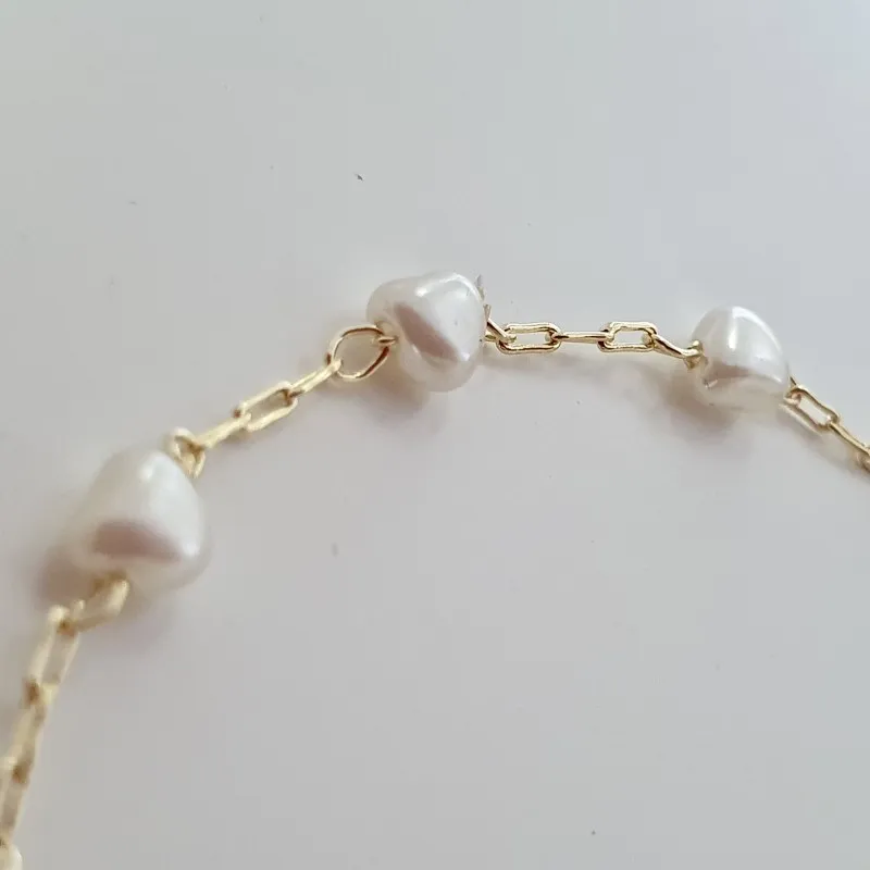 Pulseira com coração olho grego e corações pérola