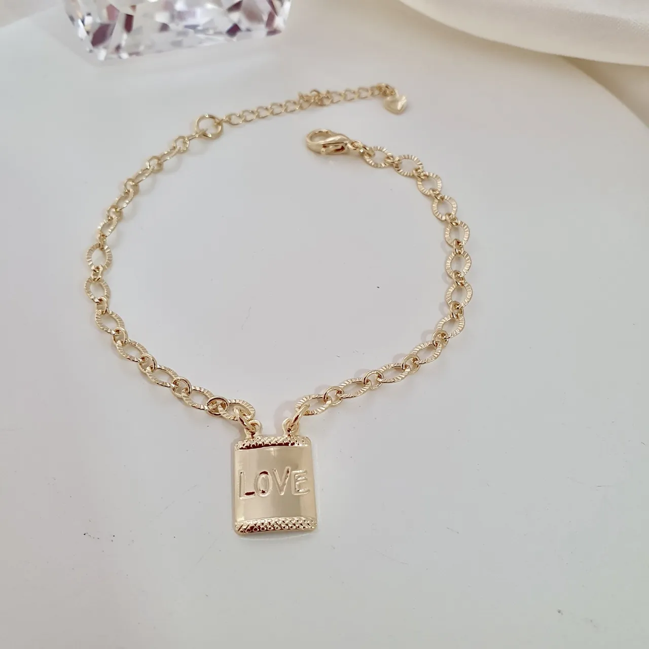 Pulseira elo diamantado e placa 