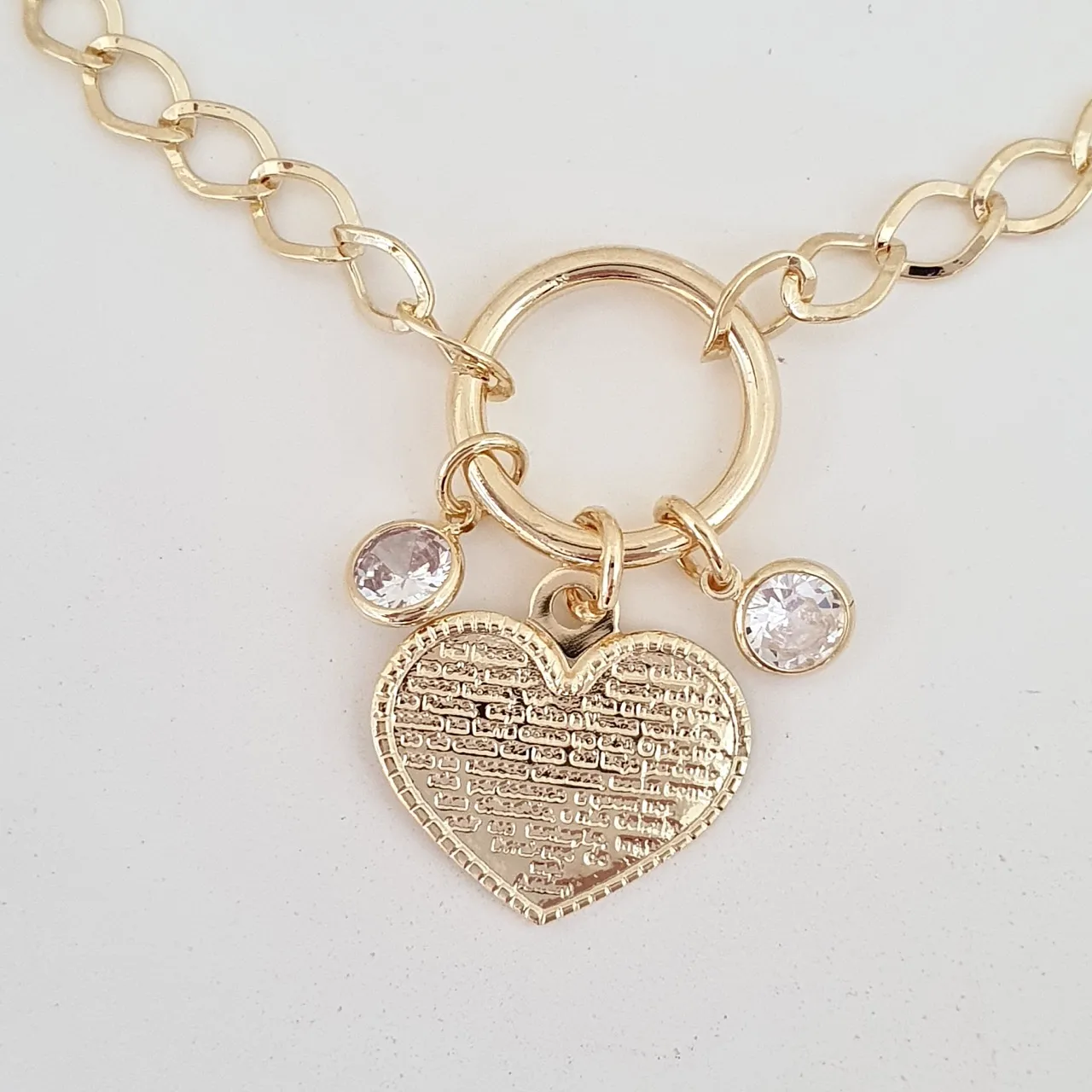 Pulseira com pingentes pontos de luz de zircônia e coração com oração Pai Nosso