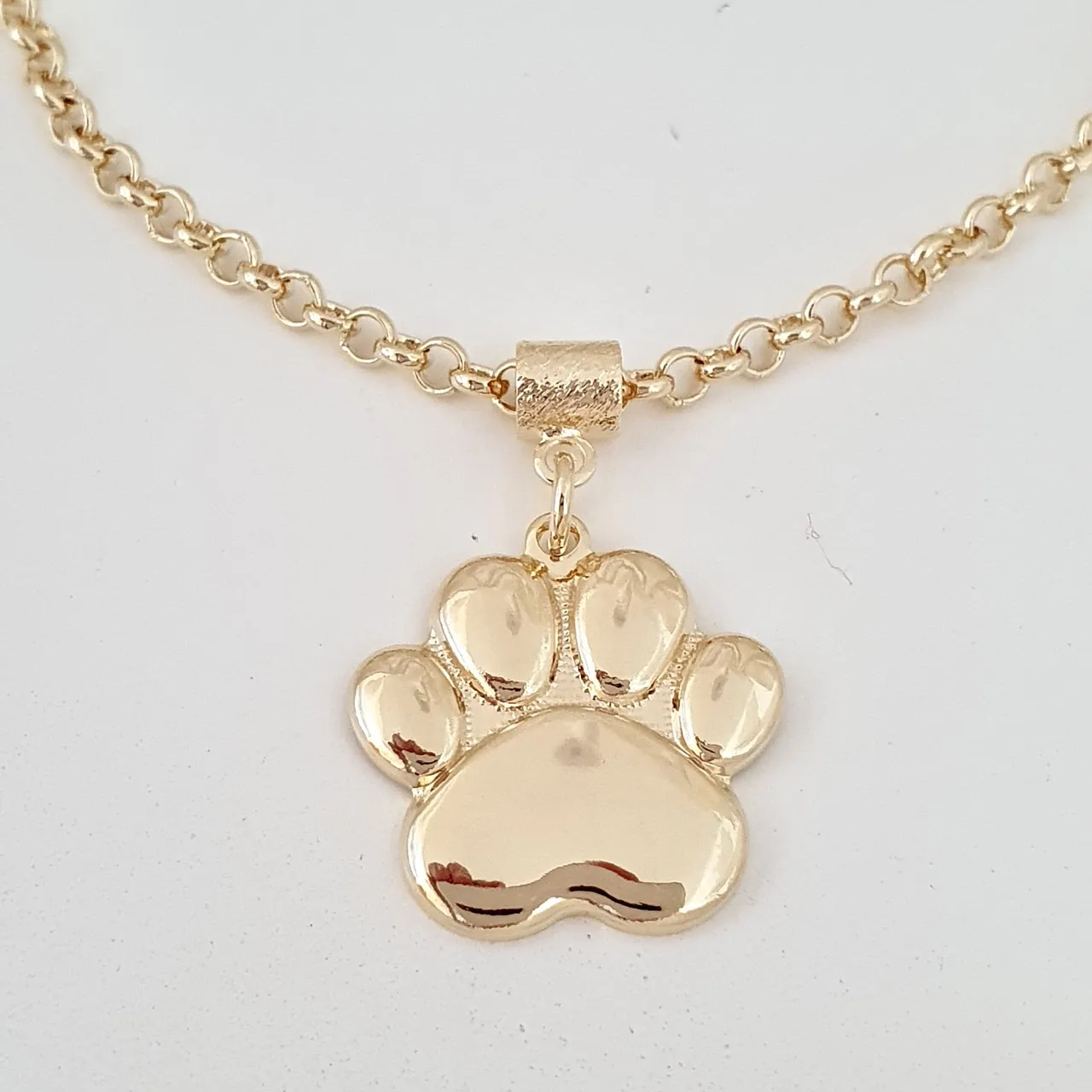 Pulseira elo português e pingente de patinha
