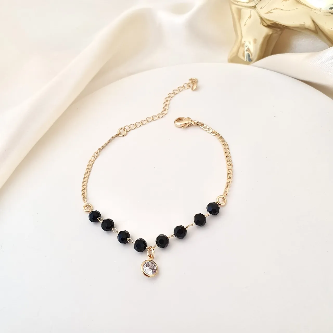 Pulseira cristal preto e ponto de luz zircônia