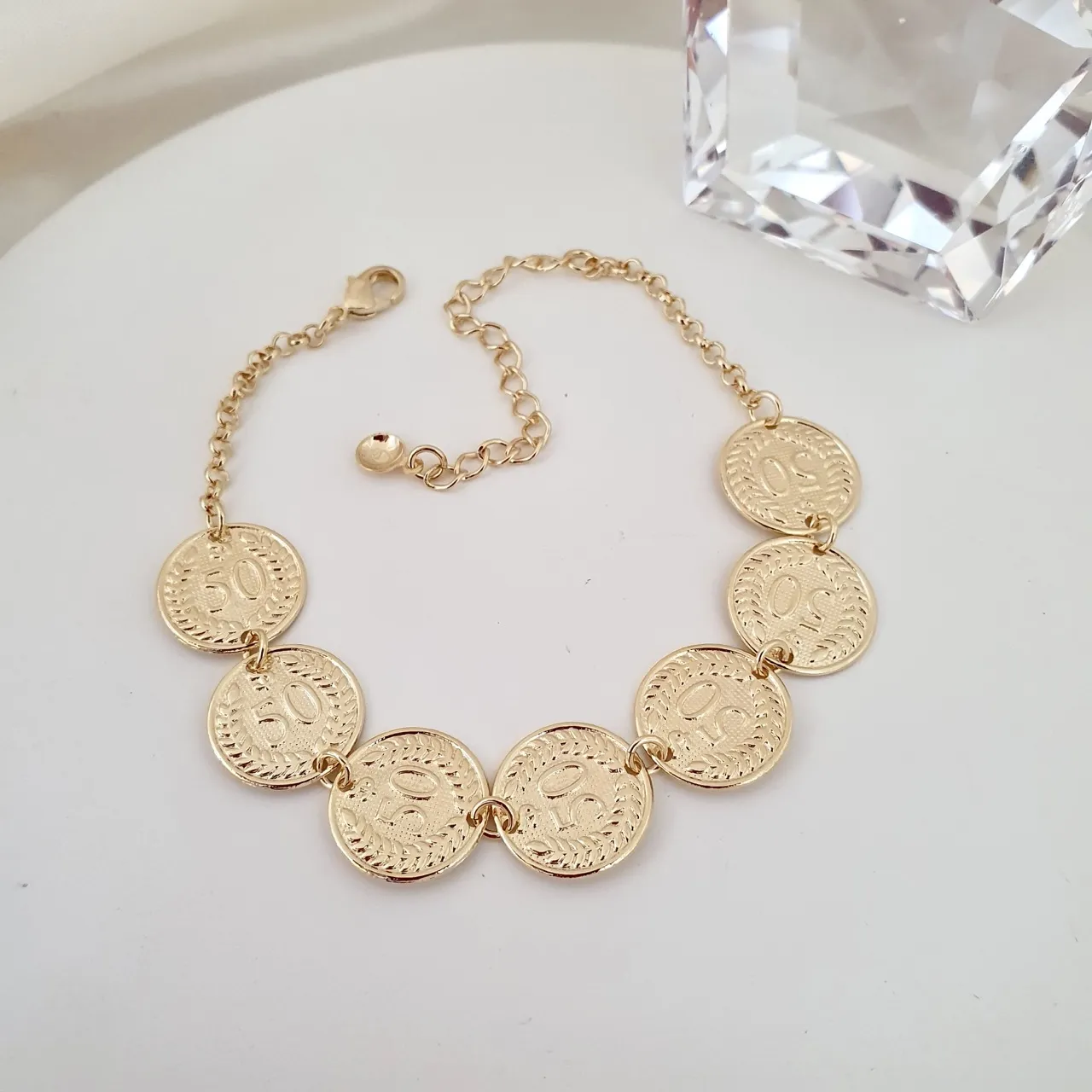 Pulseira moedas 50