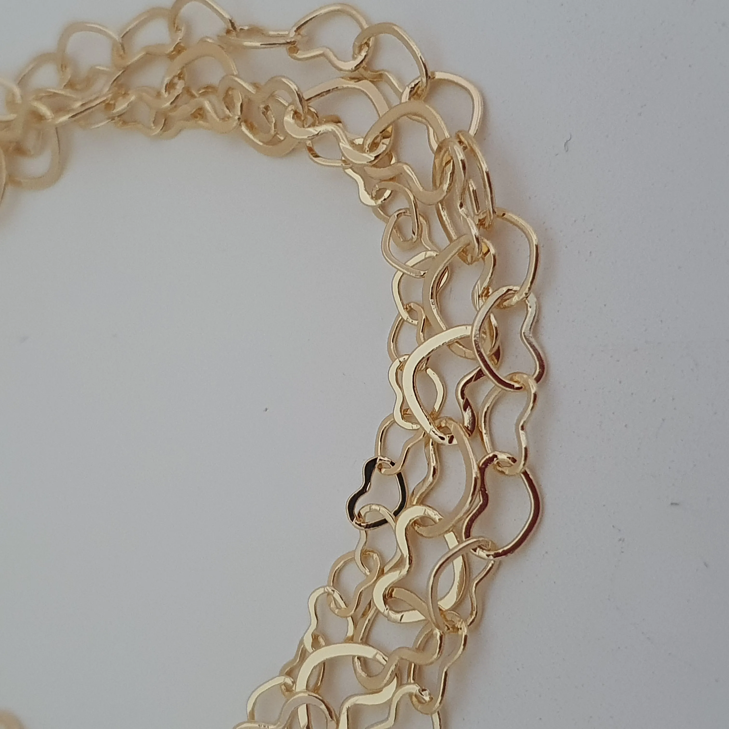 Pulseira tripla com elo de coração