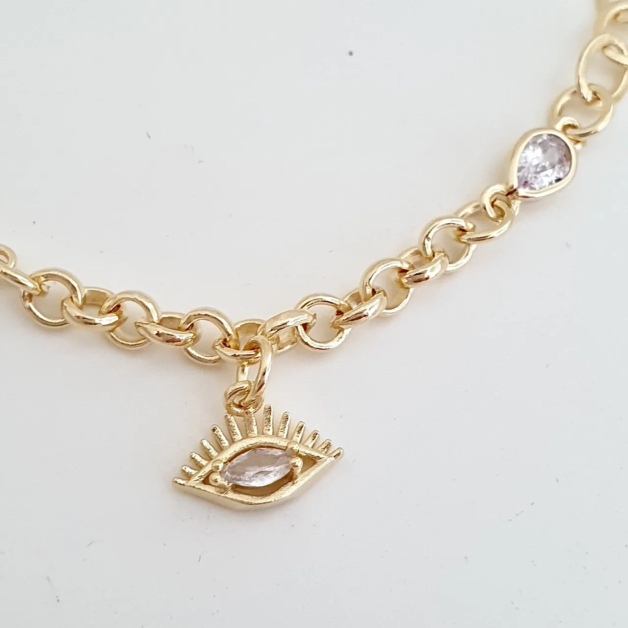Pulseira olho grego e ponto de luz
