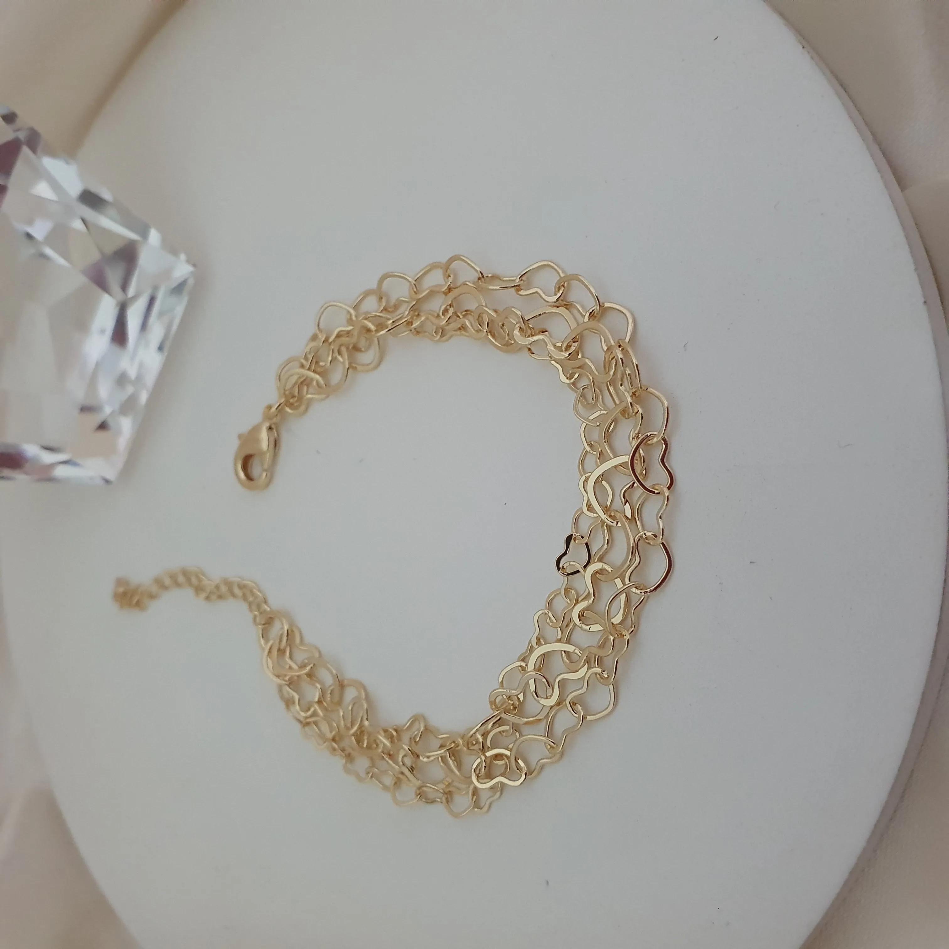 Pulseira tripla com elo de coração