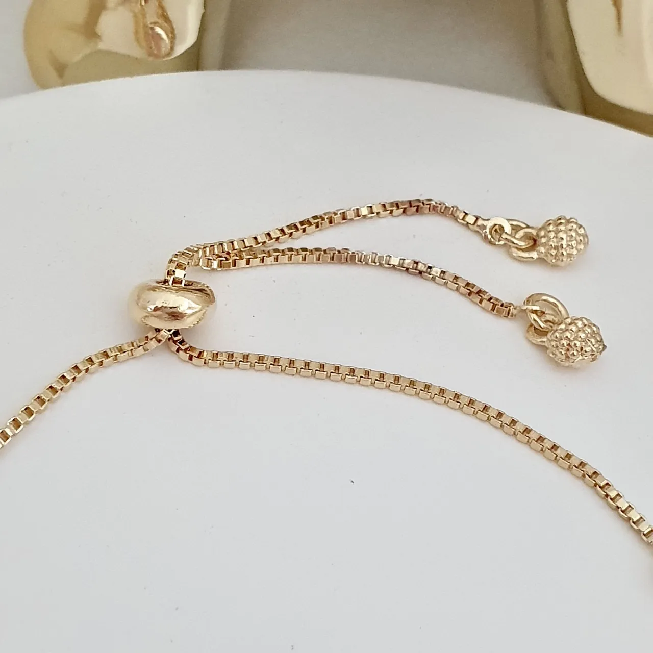 Pulseira gravatinha com medalhas