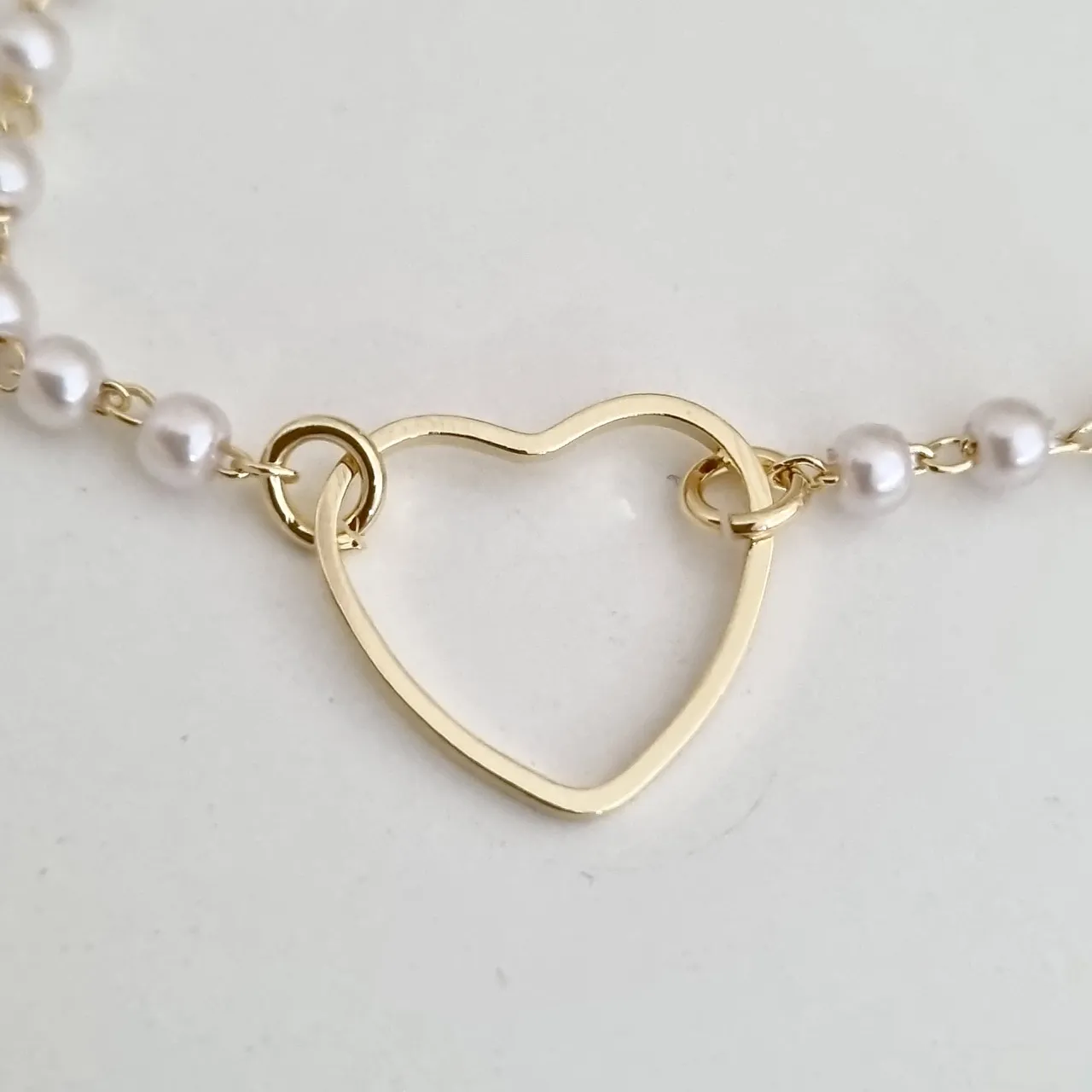Pulseira pérolas e coração