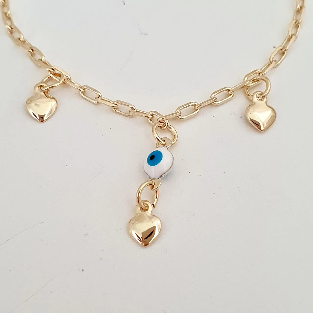 Pulseira infantil olho grego e corações