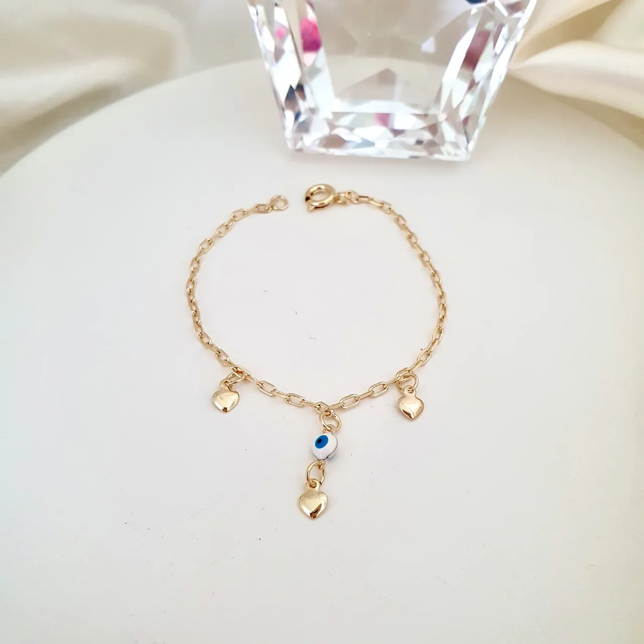 Pulseira infantil olho grego e corações