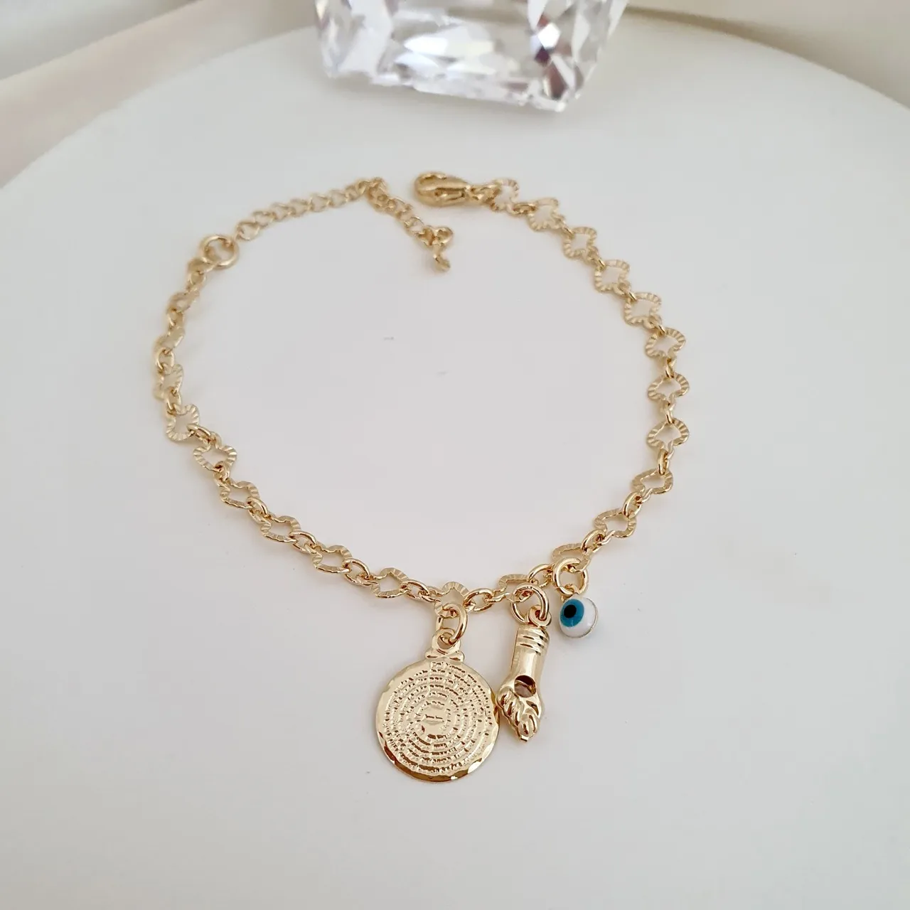 Pulseira pingentes oração, olho grego e figa com ponto de luz