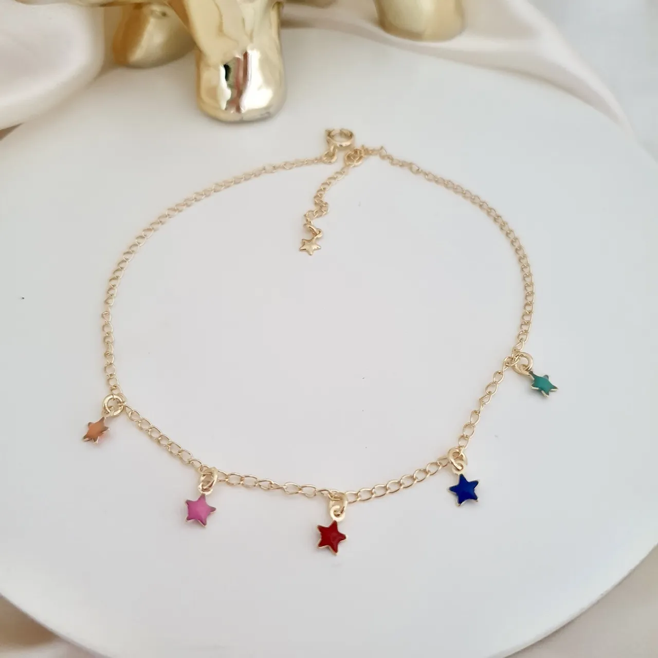 Tornozeleira estrelas coloridas