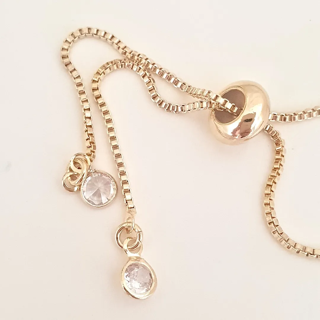 Pulseira gravatinha malha e zircônia