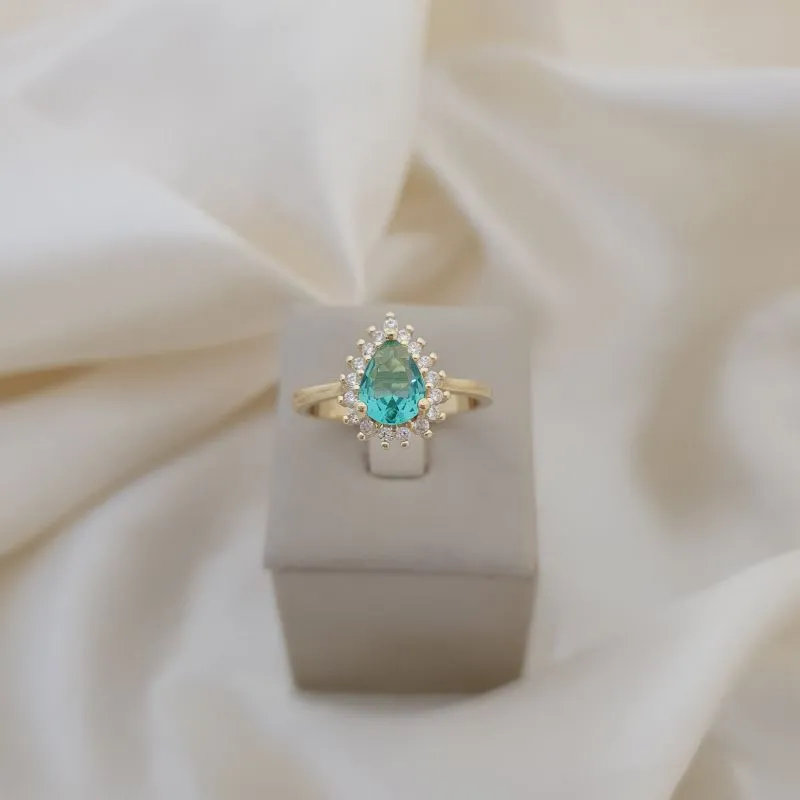 Anel gota zirconia verde claro, contorno microzirconias cor cristal